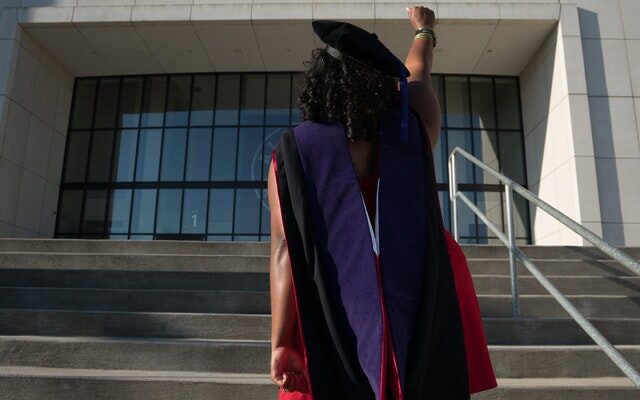 woman-standing-in-front-of-university-of-alabama-936003